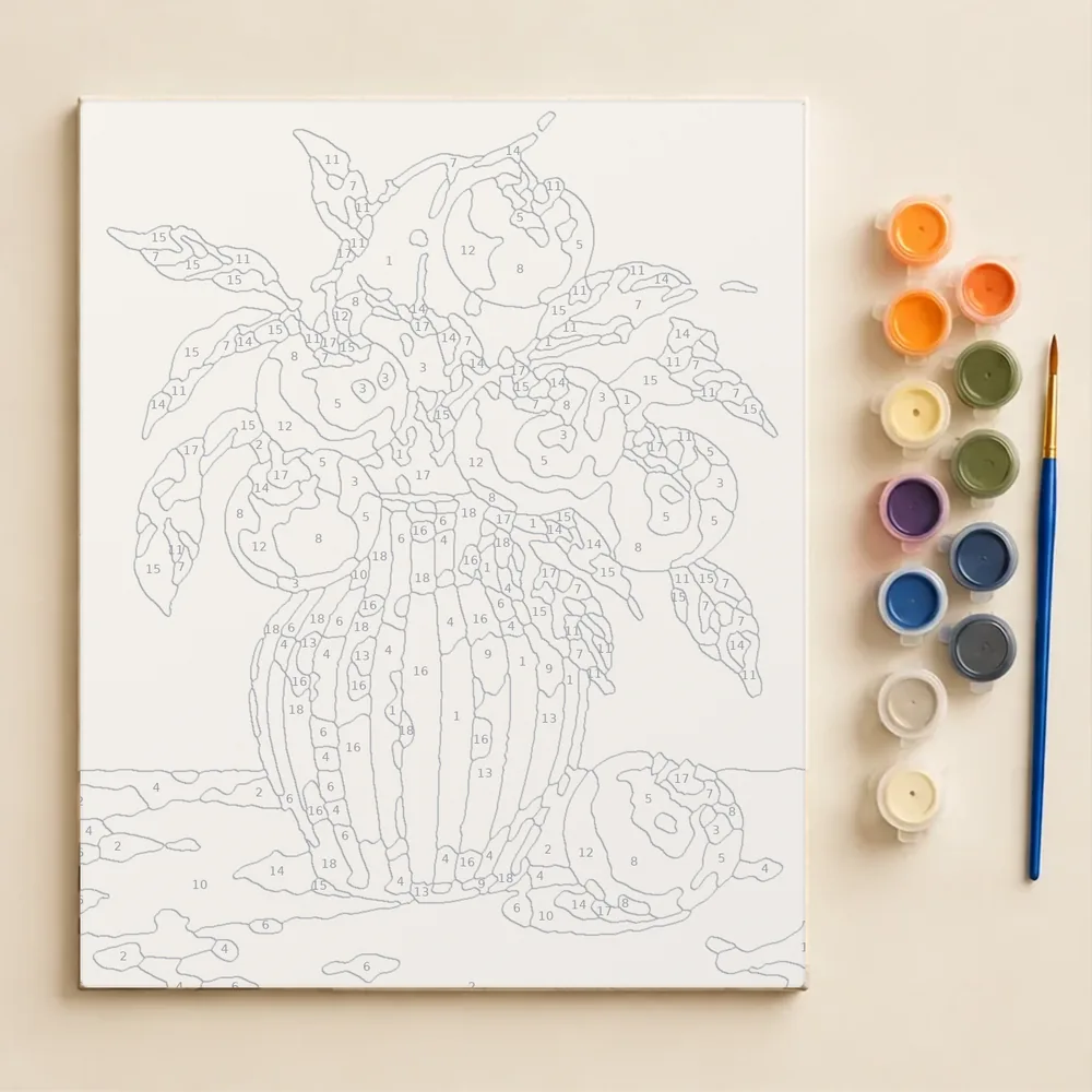 The same picture before painting, printed with outlined, numbered areas, next to the paint pots and brush
