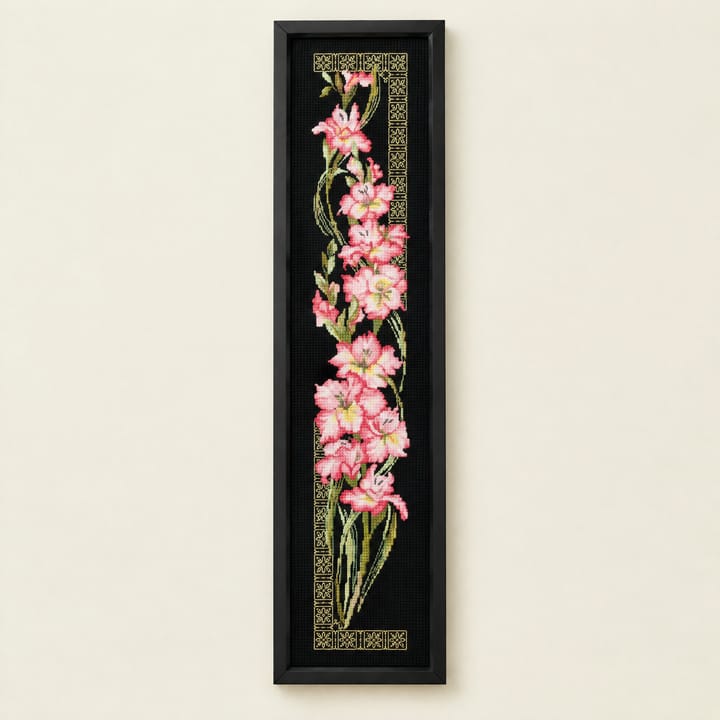 Pink orchid cross stitch panel on black Aida with a gold border