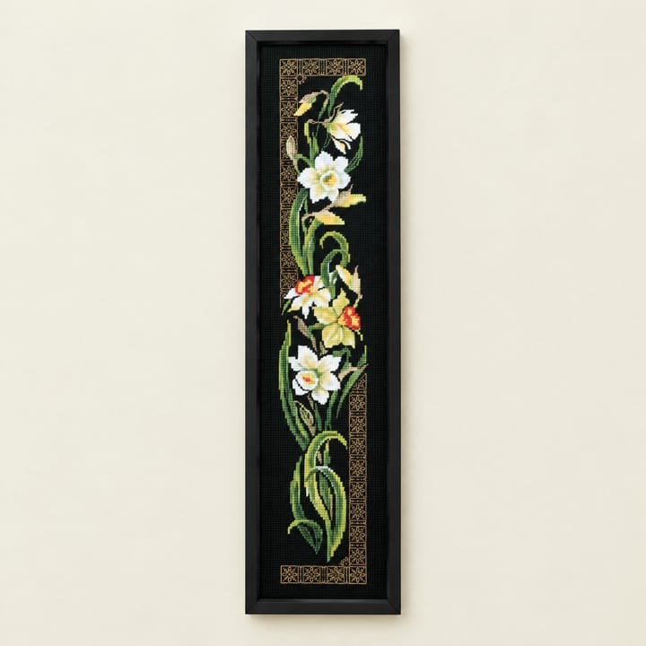 Daffodil cross stitch panel on black Aida with a gold border
