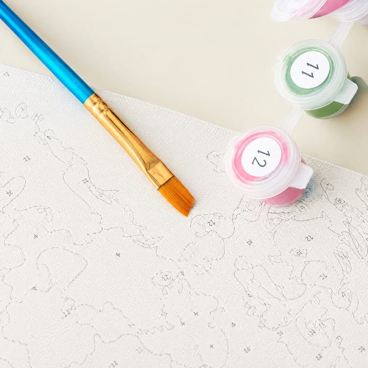 Painting a numbered area of the canvas with a flat brush
